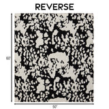 Wrangler Black & White Cowhide Stretchy Throw Blanket